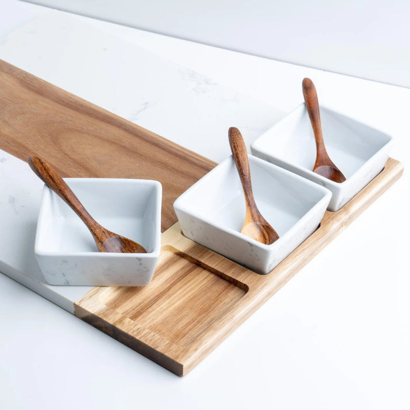 Three white square bowls with wooden spoons on a wooden tray at jazzis creations in orange park fl
