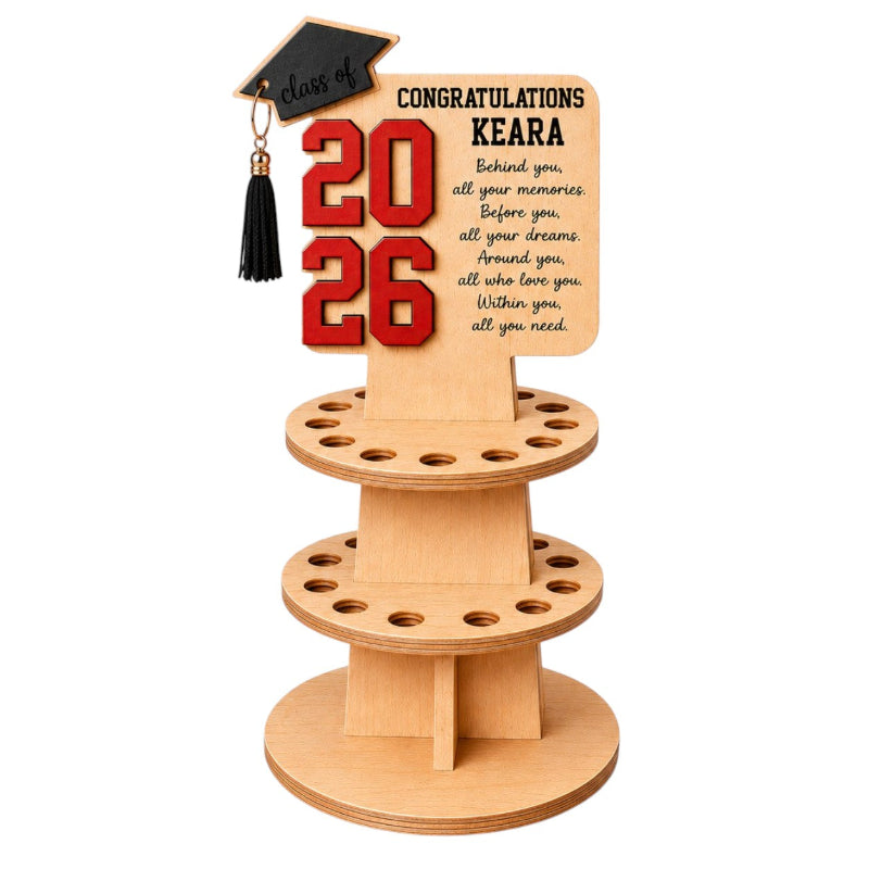 Custom wooden graduation money stand with laser cut layered numbers, engraved message, and black graduation cap on white background