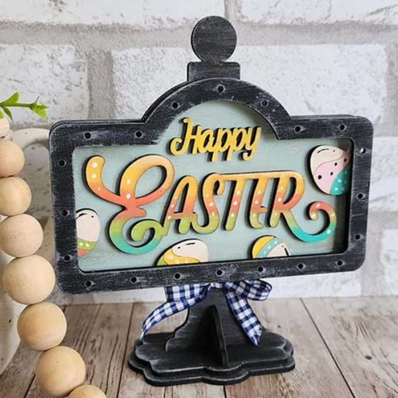 Hand-painted Happy Easter interchangeable mini stand insert with pastel eggs displayed on black wooden tabletop stand by Jazzi’s Creations