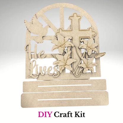 DIY He Lives Easter cross wooden craft kit with lilies and dove, unpainted Christian shelf sitter project by Jazzi's Creations in orange park fl