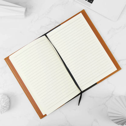 Open notebook with lined pages on a white surface