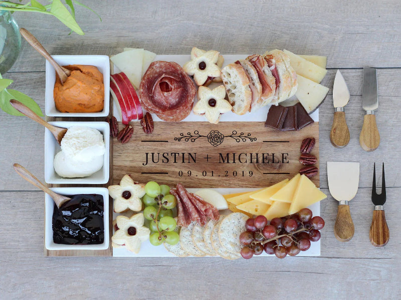 Personalized cheeseboard with assorted meats, cheeses, fruits, and accompaniments on a wooden board at jazzis creations in orange park fl
