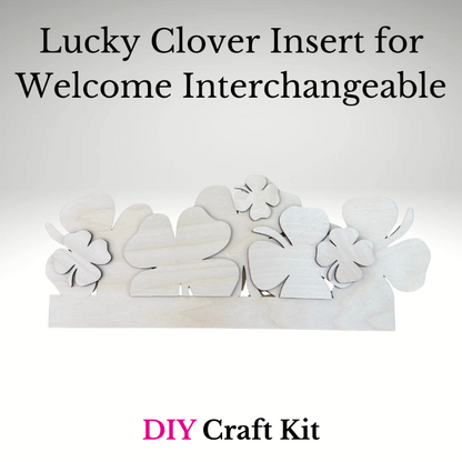 White lucky clover inserts for a welcome interchangeable DIY craft kit on a light gray background.