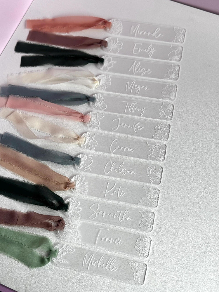 clear acrylic book mark with floral design and personalized name with ribbon