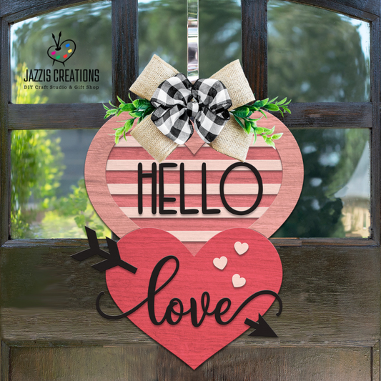 DIY Hello Love Valentine door hanger kit made from layered unfinished wood hearts with engraved lettering, ready to paint and assemble.