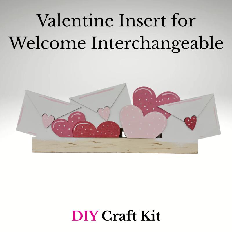 Valentine-themed DIY craft kit with hearts and envelopes on a stand against a light background.
