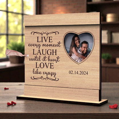 Personalized Valentine’s Day wooden photo frame with engraved love quote, heart-shaped photo opening, and tabletop stand, displayed with a couple’s photo.