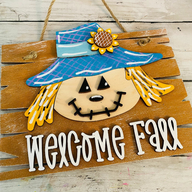 Wooden sign with a scarecrow face and 'Welcome Fall' text on a wooden background crafts-4-kids at jazzis creations in orange park fl